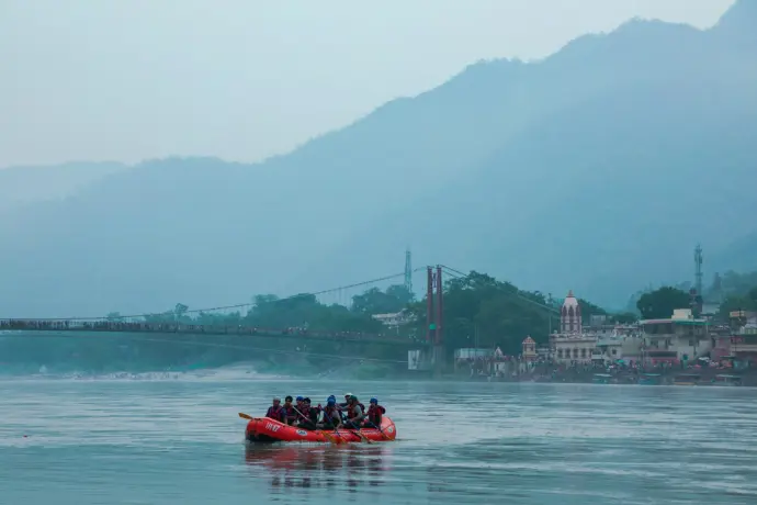 a group of people in a raft on a river